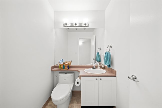 Half bath with vanity, baseboards, and toilet | Image 7
