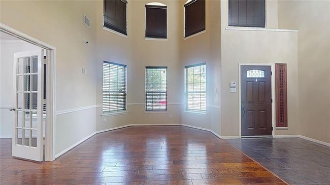 This home is bathed in natural light, thanks to its abundant windows. | Image 6
