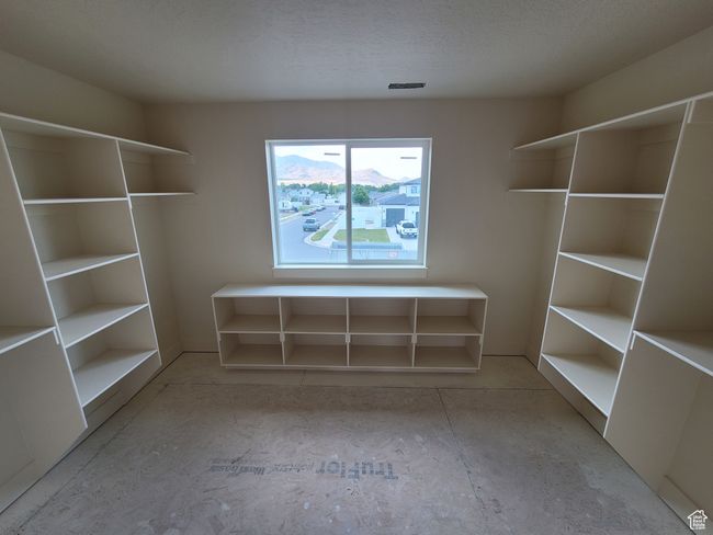 The walk-in-closet of the Owner's Suite has plenty of storage space and even a view! | Image 15