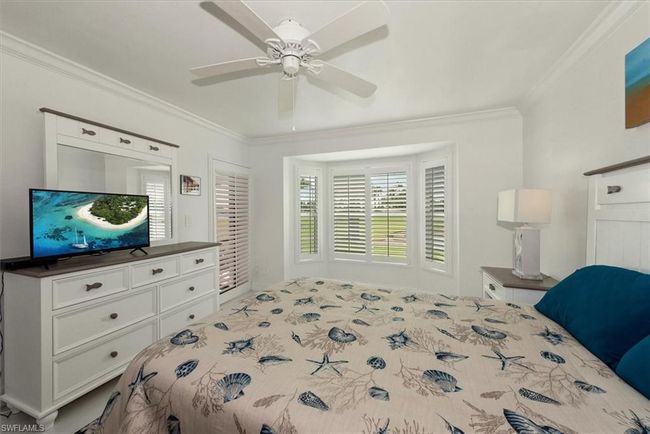 Bedroom with crown molding and a ceiling fan | Image 17