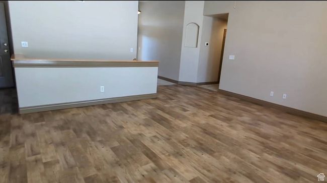 Unfurnished room featuring wood finished floors and baseboards | Image 18