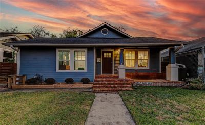 Make this gorgeous craftsman home yours! It features four spacious bedrooms, two beautifully appointed bathrooms, and a single-car garage. An electric vehicle charger is installed in the driveway near the garage! | Image 2