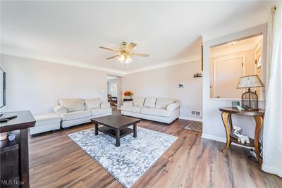 Living room with ceiling fan and hardwood / wood-style flooring | Image 3