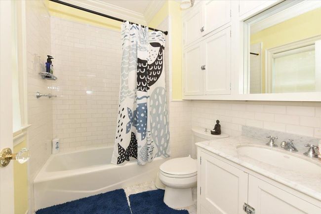Full bath featuring vanity, ornamental molding, and a shower stall | Image 18