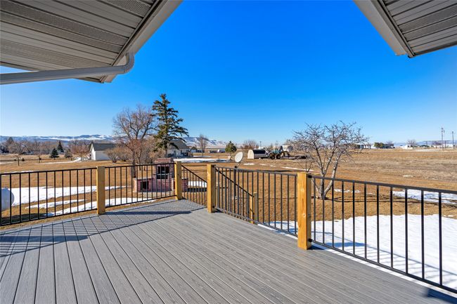 Expansive deck space, perfect for gatherings or quiet mornings | Image 26
