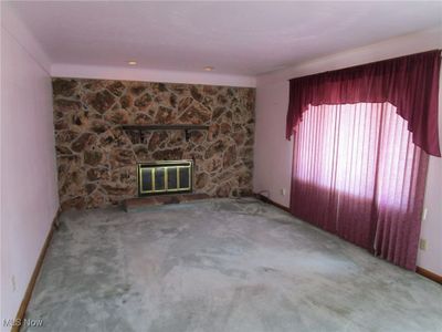 Living Room with Gas Log Fireplace and Large Picture Window | Image 3