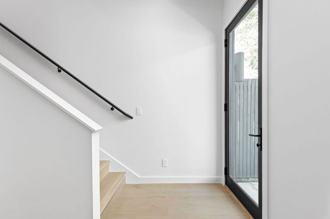 Foyer with light wood-type flooring, stairs, and healthy amount of natural light | Image 7