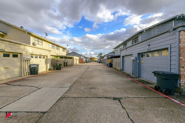 View of road with a residential view and community garages | Image 29