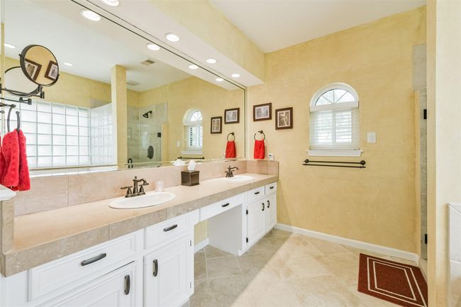 Full length mirror, recessed lighting, neutral tiles, and updated hardware. | Image 26