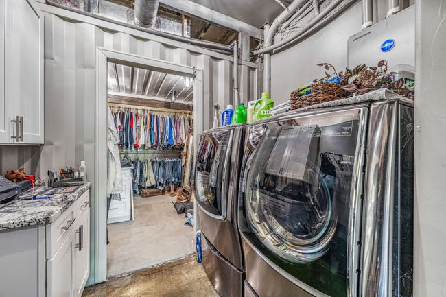 Washroom with cabinet space and separate washer and dryer | Image 12
