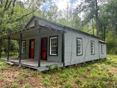 Side View of home Use your imagination to renovate this Shotgun Home | Image 1