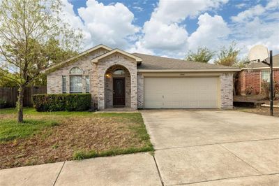 Ranch-style home with a garage | Image 1