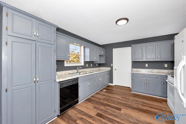 New LVP flooring and paint, wood cabinetry, pantry | Image 23
