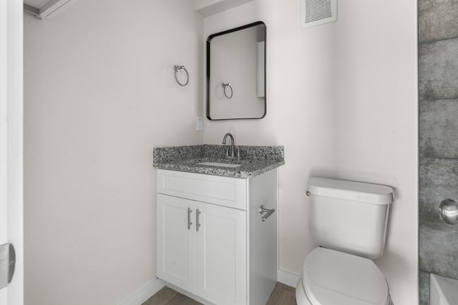 Bathroom with vanity and wood finished floors | Image 10