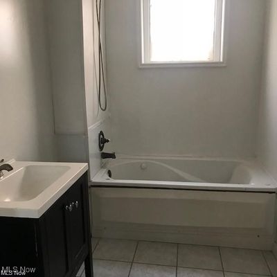 Bathroom featuring tile patterned flooring and vanity | Image 3