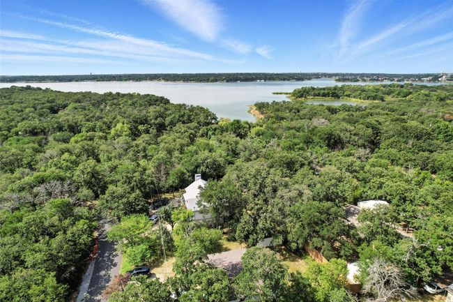 Drone / aerial view of a forest and a large body of water | Image 18