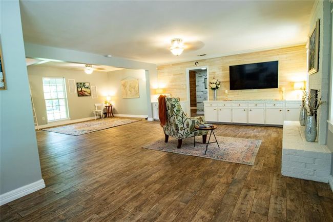 View from breakfast area toward the den to the right and living area to the left. | Image 15
