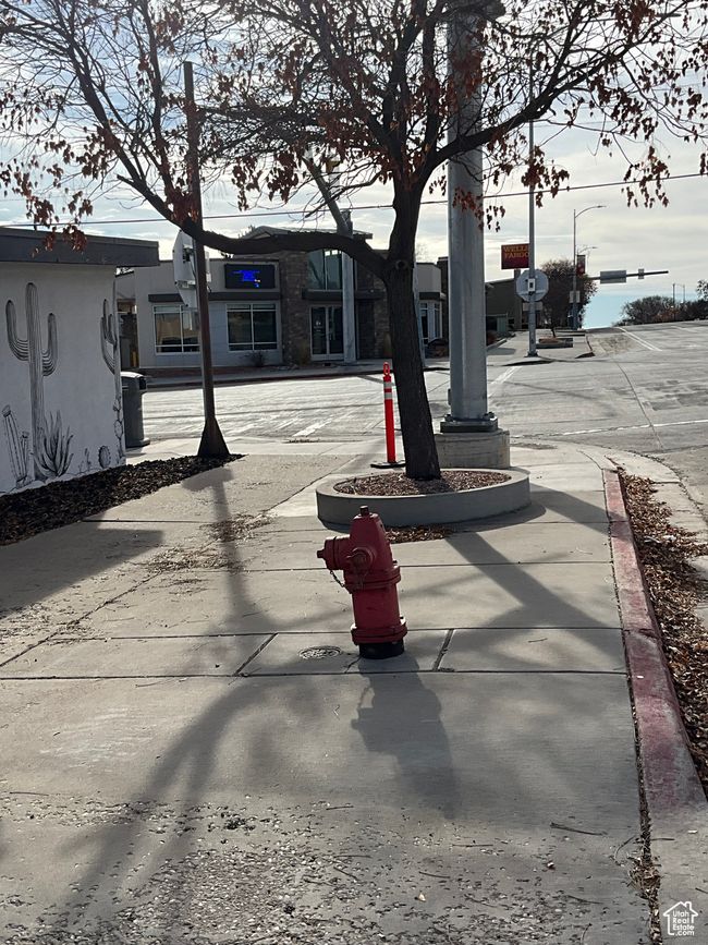 View of road featuring street lights and sidewalks | Image 10