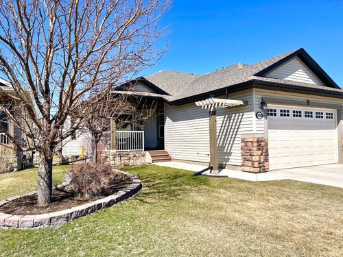 1909 Riverside Drive Nw, Home with 2 bedrooms, 2 bathrooms and 4 parking in High River AB | Card Image