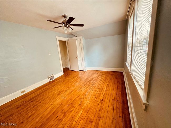 Large master bedroom, fresh paint, fan and hardwood floors | Image 8