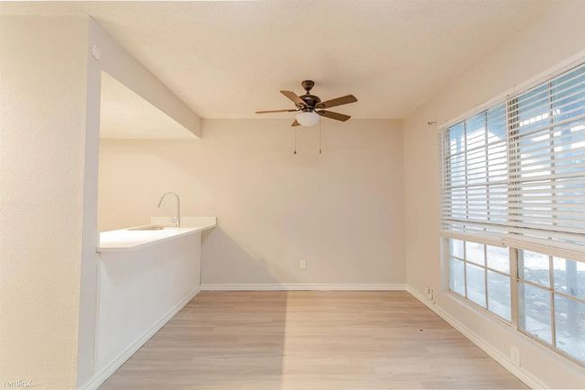 Unfurnished room featuring light wood-style flooring and ceiling fan | Image 4