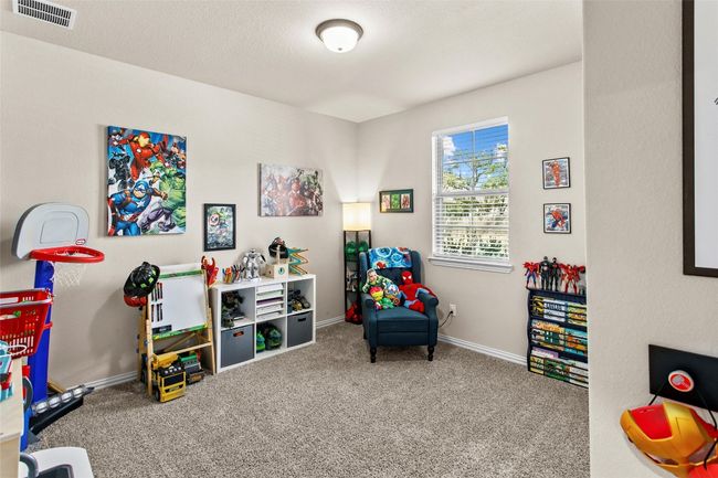 Game room with carpet flooring and baseboards | Image 23