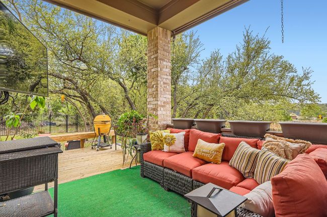 View of patio / terrace featuring an outdoor living space, a wooden deck, and fence | Image 29
