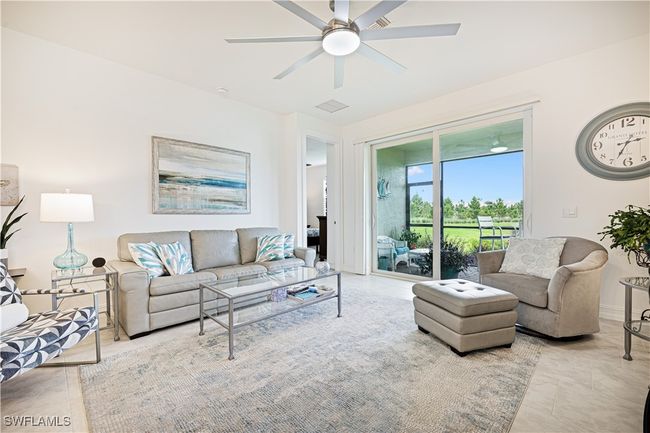 Tiled living room featuring ceiling fan | Image 10