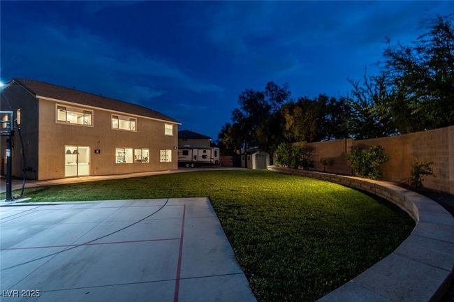 View of yard with a fenced backyard and a patio | Image 52