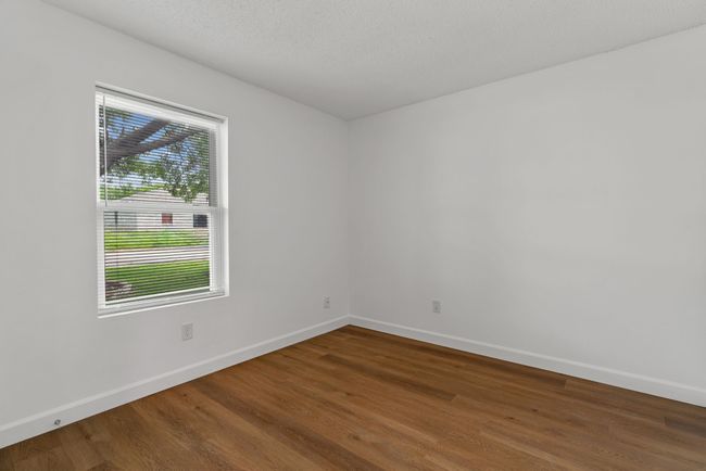 Empty room featuring wood finished floors | Image 26