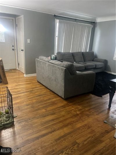 Living room featuring hardwood / wood-style flooring | Image 2