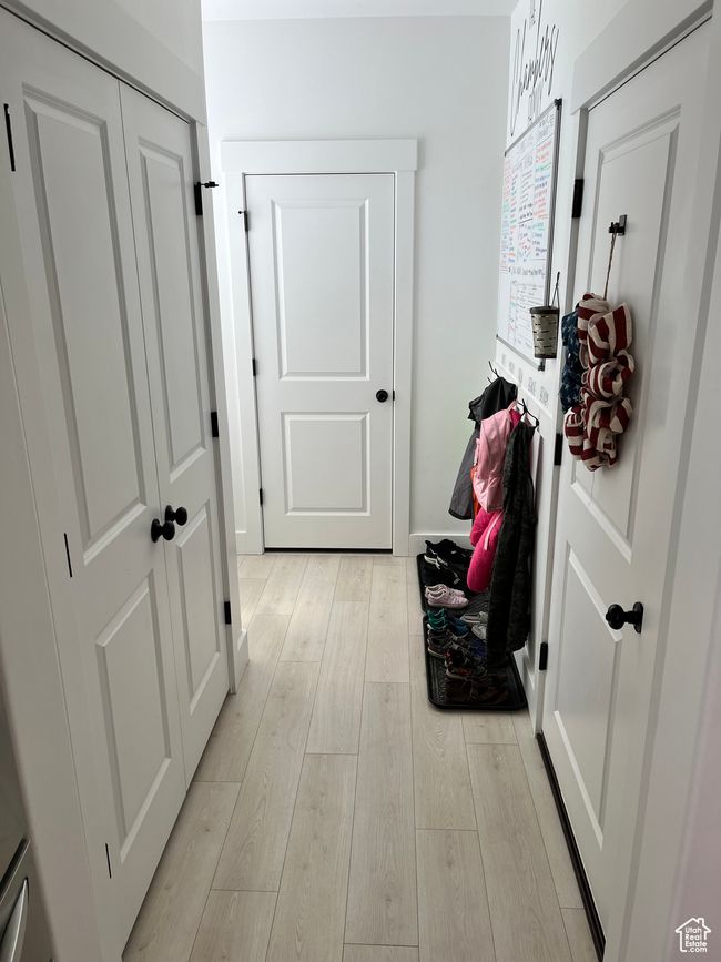 Hallway with light wood-style floors | Image 9