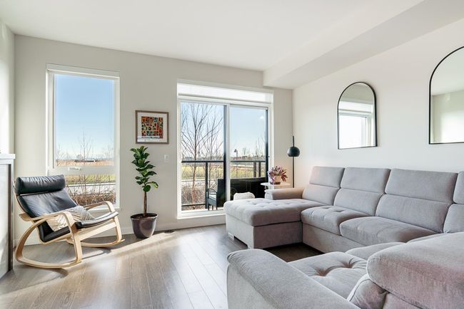 Living room featuring baseboards and wood finished floors | Image 13