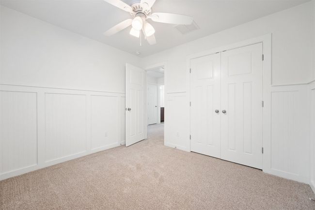 Each room features carpet flooring, a ceiling fan and an ample sized closet | Image 31