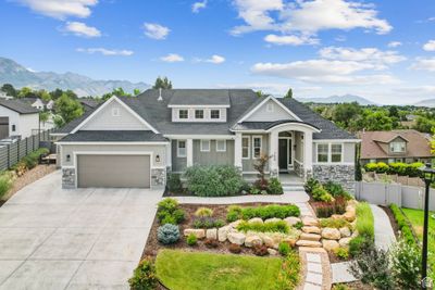 Craftsman-style home featuring a mountain view and a garage | Image 1