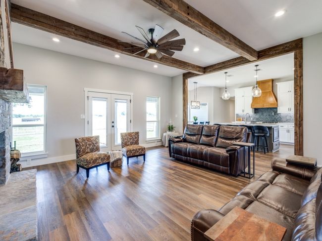 Huge family room is perfect for gathering friends and family. Notice the beautiful views out of the windows. | Image 7