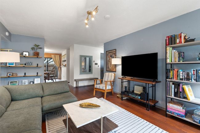 Living area with wood finished floors | Image 13