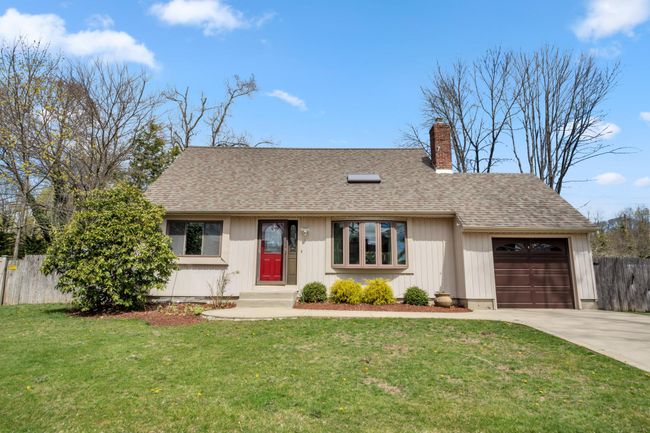 Ranch-style house featuring a chimney, concrete driveway, fence, a garage, and roof with shingles | Image 22