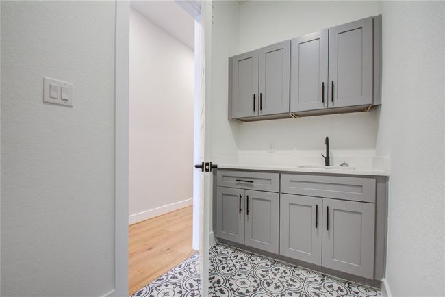 Laundry room with built in wet bar and cabinetry! | Image 30
