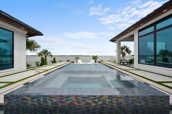 View of swimming pool featuring an in ground hot tub | Image 26