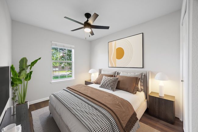 Bedroom featuring wood finished floors and a ceiling fan | Image 24