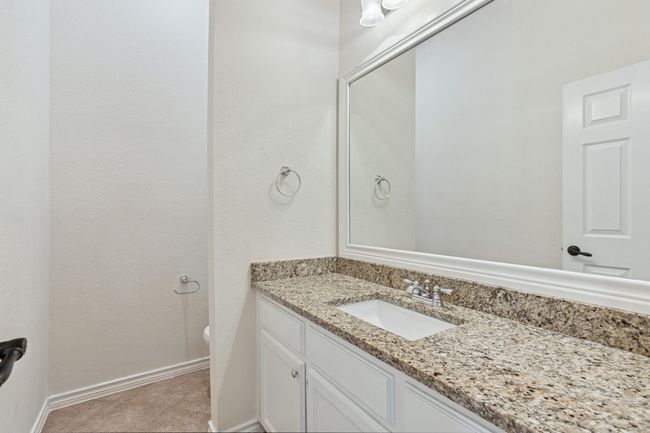 Half bathroom with vanity and baseboards | Image 22