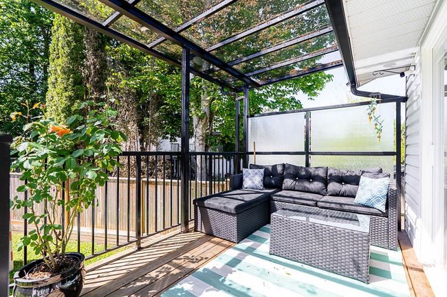 Sunroom featuring an outdoor living space | Image 21