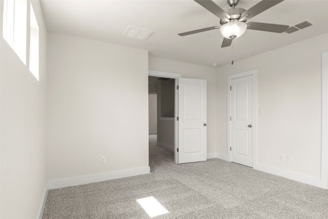 Unfurnished bedroom with visible vents, carpet, and baseboards | Image 20