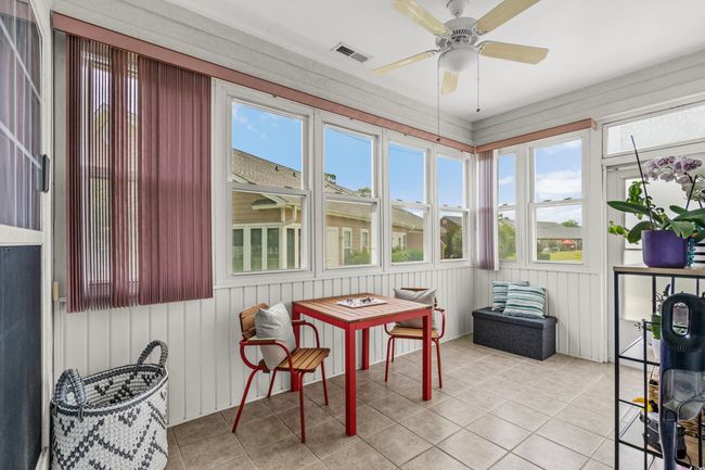 Sunroom featuring ceiling fan and healthy amount of natural light | Image 19