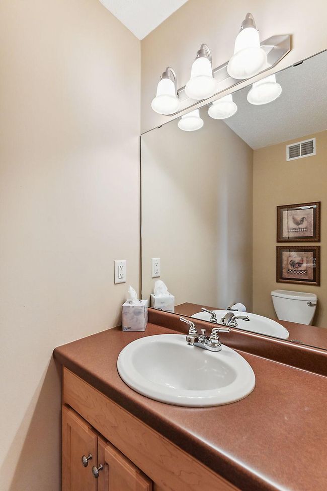 Of course, every home needs a main floor guest bath. | Image 11