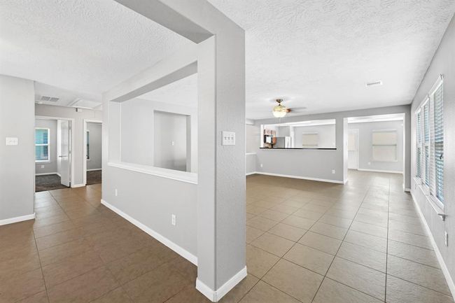 Entry way view, left is formal dinning, right is living room area. | Image 6