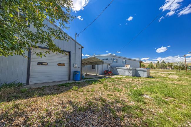 View of yard featuring a carport | Image 22