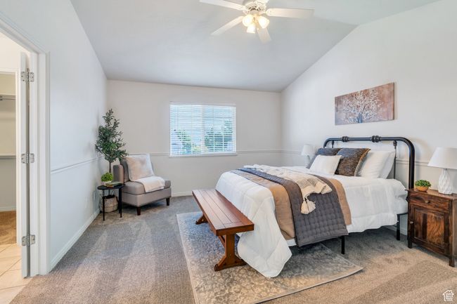 Carpeted bedroom featuring vaulted ceiling, a ceiling fan, and baseboards | Image 8