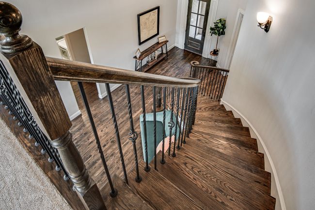 Stairs featuring wood-type flooring | Image 32